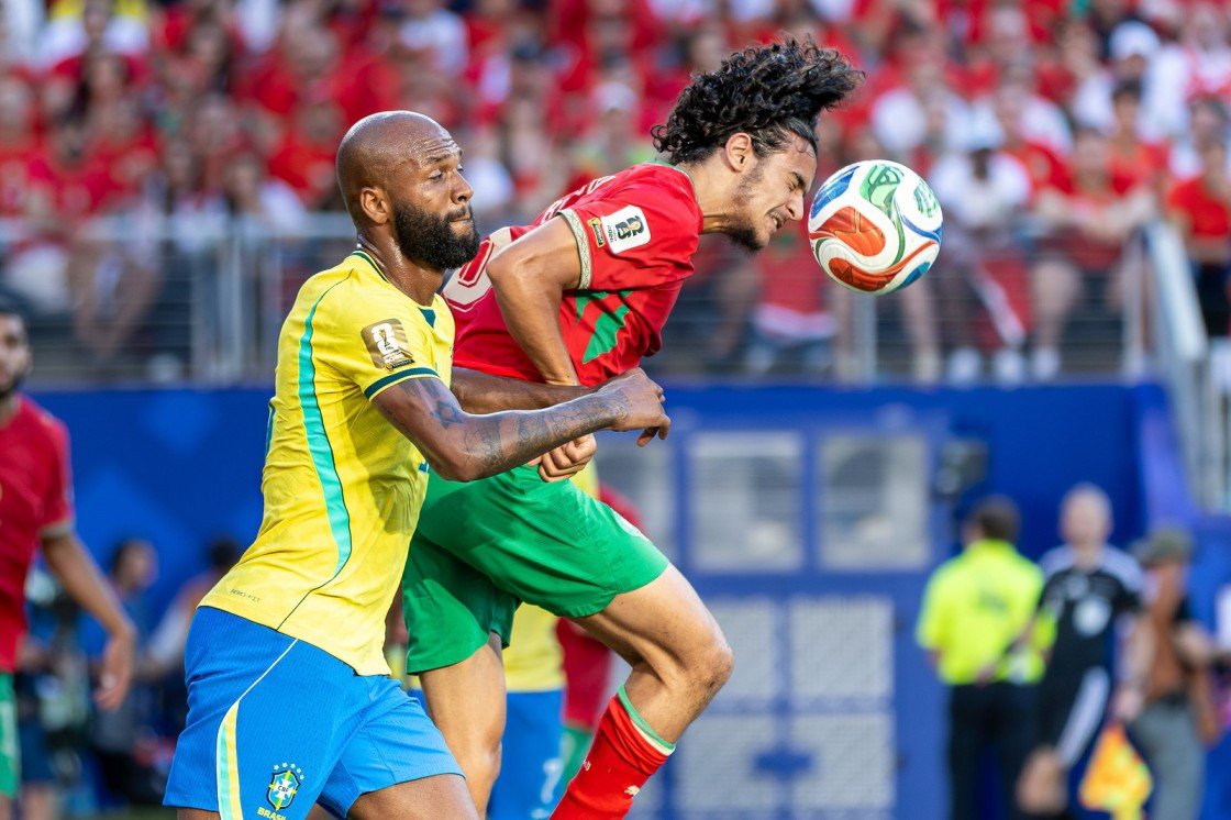Brazil forward Igor Thiago and Morocco midfielder Ayyoub Bouaddi battle for the ball during World Cup.
