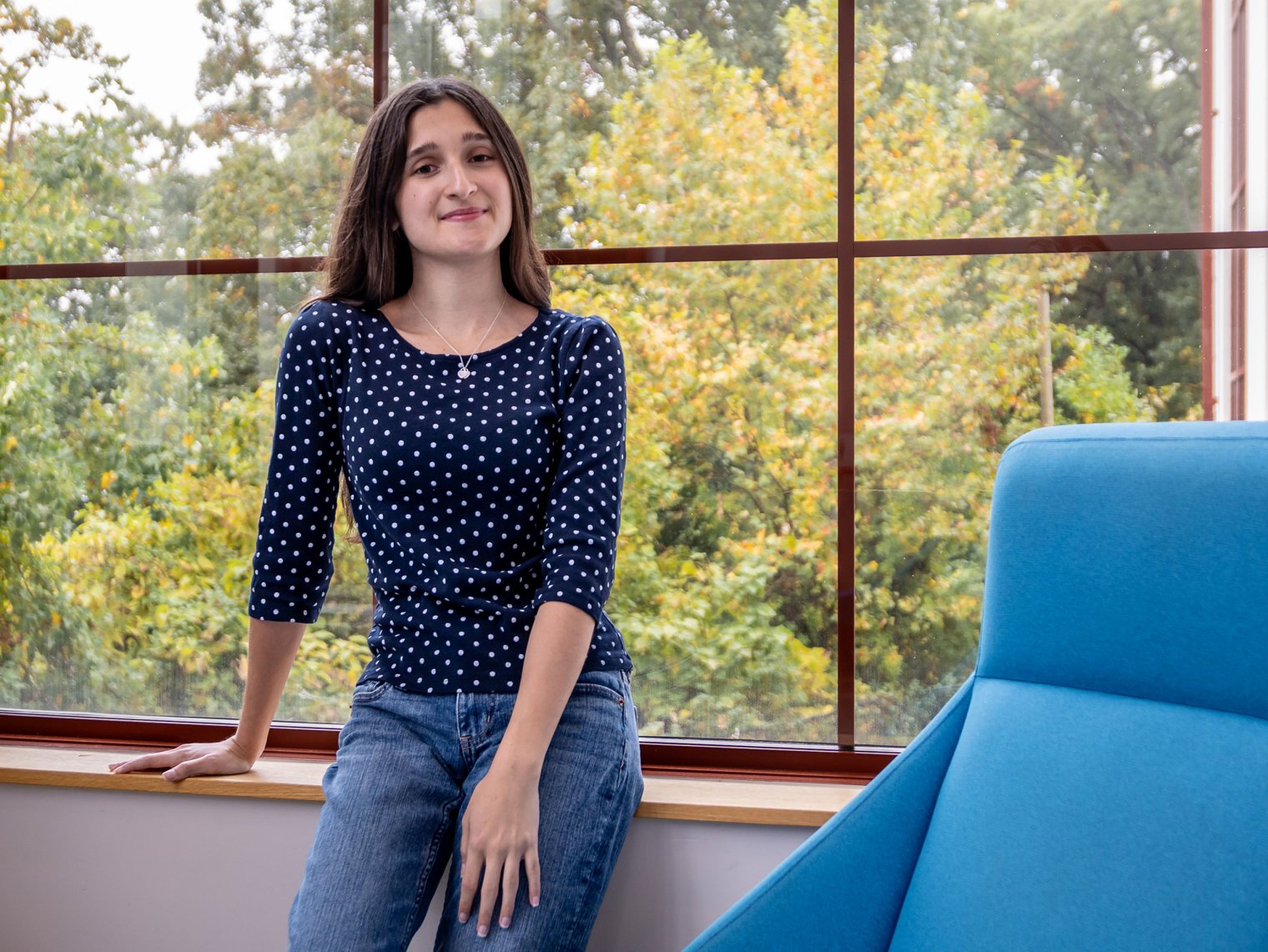 Madison Garcia stands near some windows at Montclair.