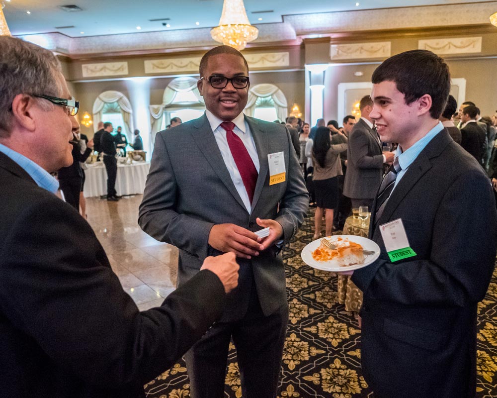 Students at school of business luncheon