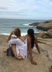 Students on rocky shore in Brazil