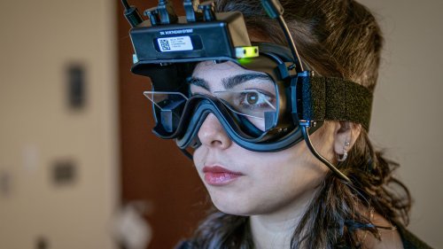 A student wears virtual reality goggles.