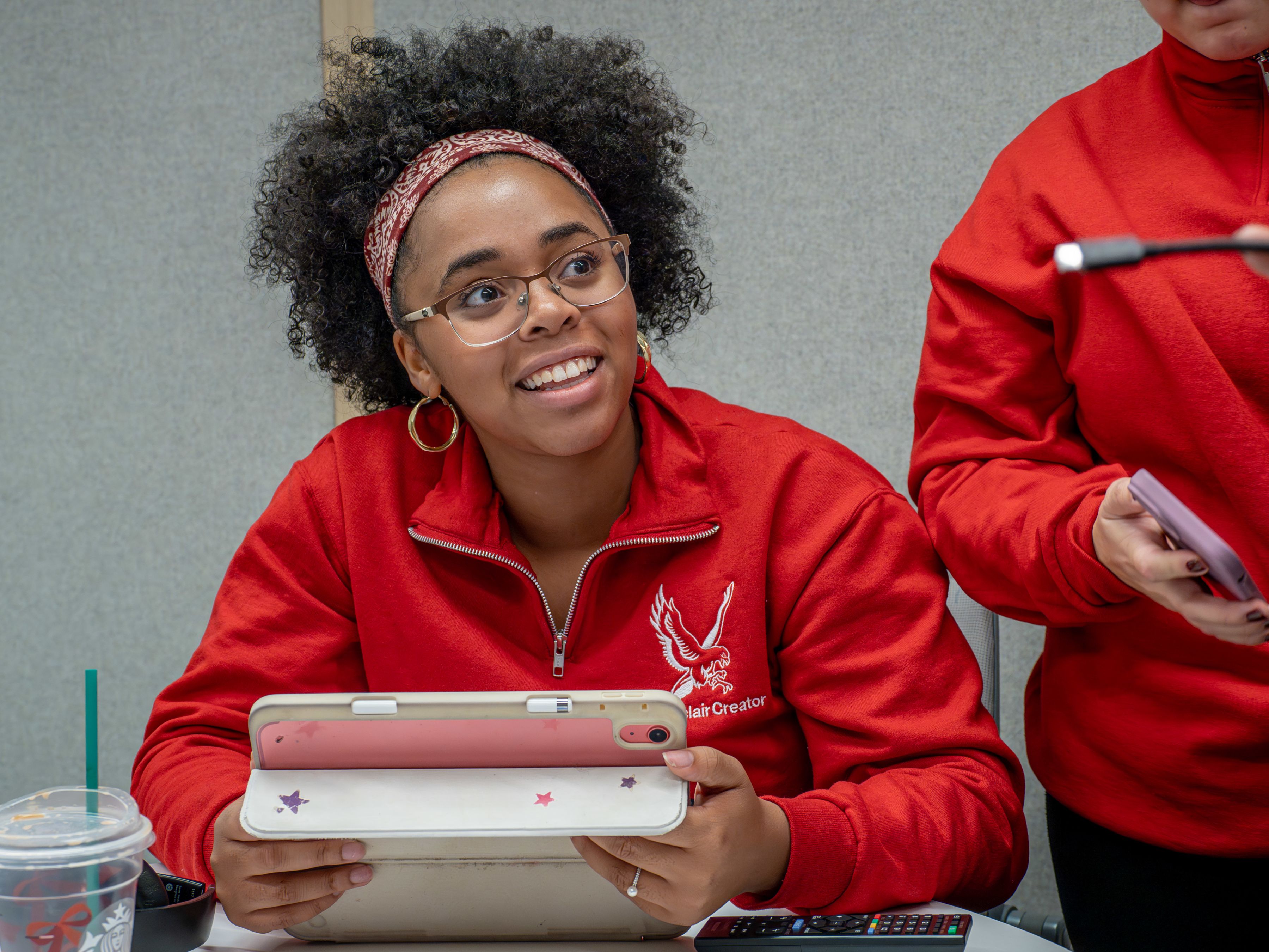 Student ambassadors brainstorm around a conference table