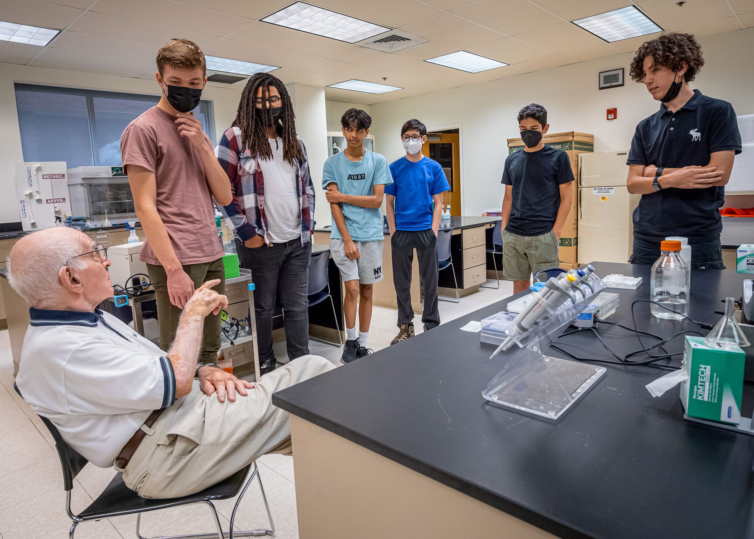 Weston Scholars showing Josh Weston what they are working in in their Biology group