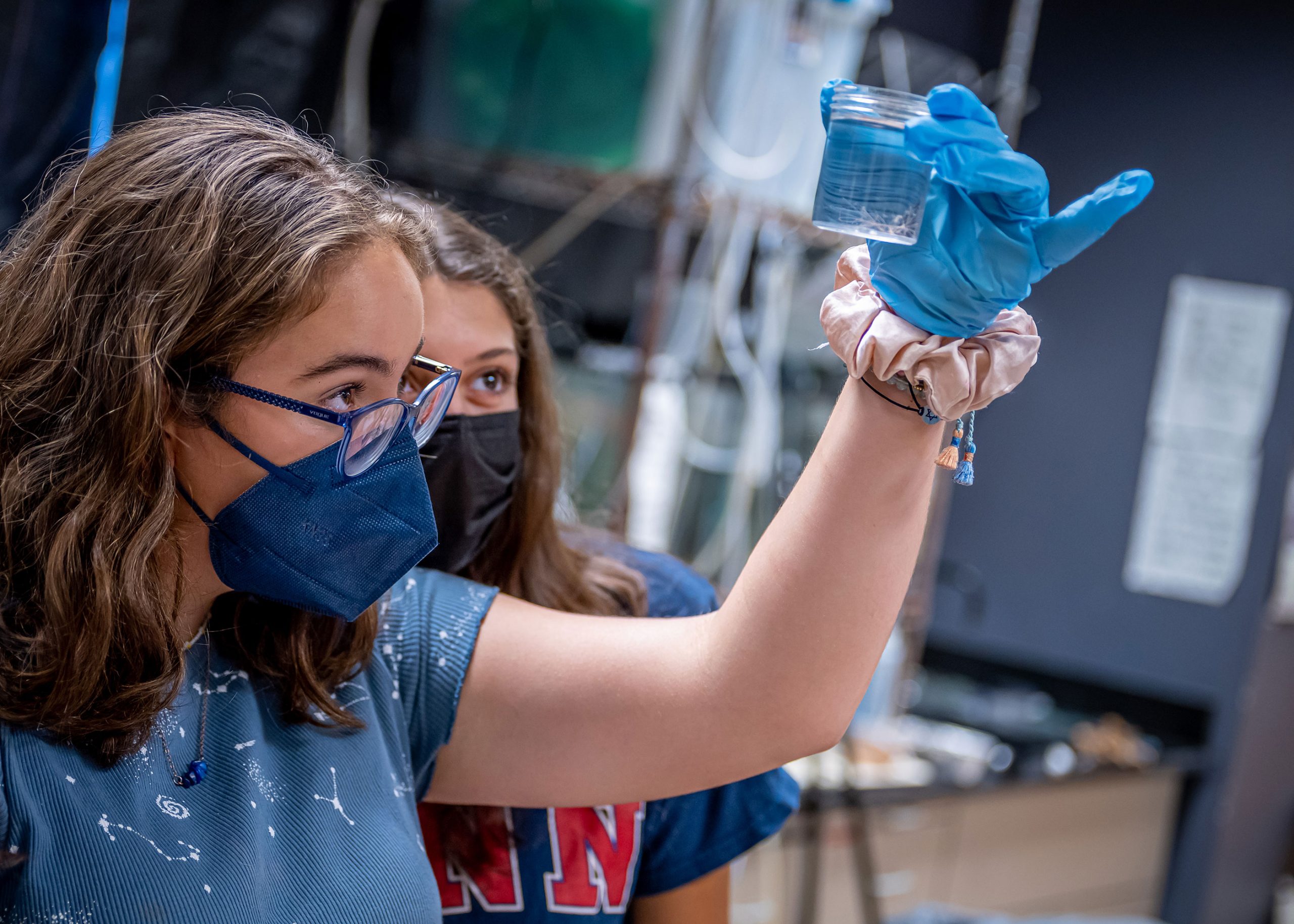 Weston Scholar holding jellyfish sample
